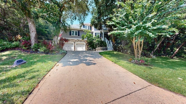 view of front of house featuring a front yard and a garage