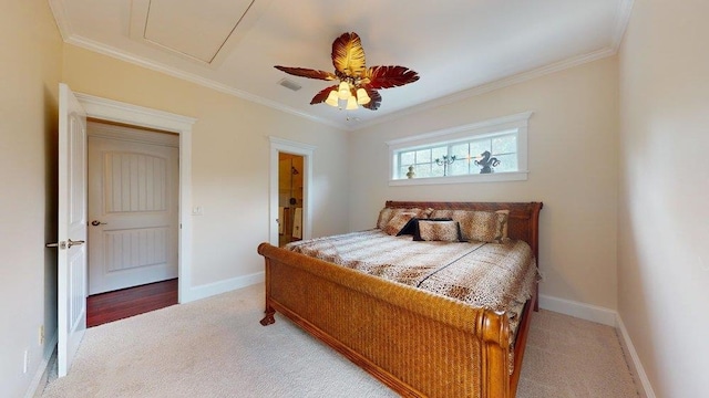 carpeted bedroom featuring ceiling fan and crown molding