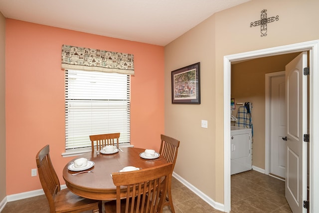 dining room featuring tile patterned flooring and washer / clothes dryer