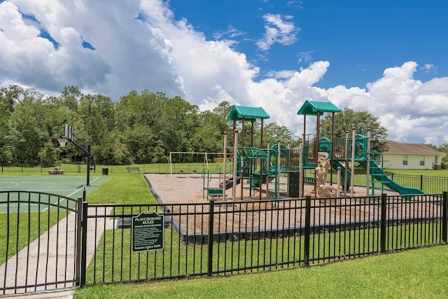 view of jungle gym featuring a yard and basketball court