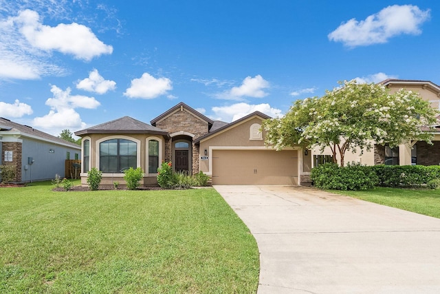 view of front of home featuring a front lawn and a garage