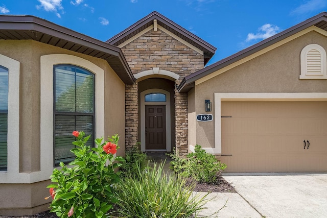 property entrance with a garage