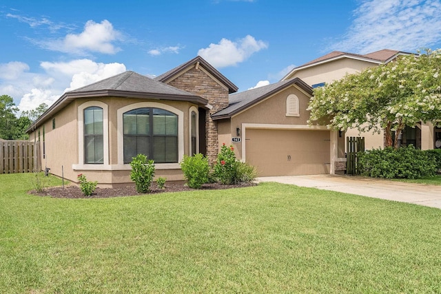 view of front of house featuring a garage and a front yard