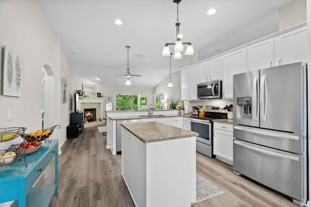 775 E Red House Branch Rd, Saint Augustine, FL 32084 - kitchen featuring stainless steel appliances, a sink, a peninsula, white cabinetry, and recessed lighting