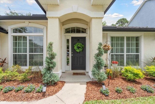 775 E Red House Branch Rd, Saint Augustine, FL 32084 - view of exterior entry featuring stucco siding