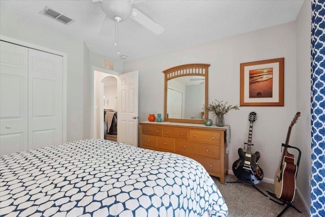 775 E Red House Branch Rd, Saint Augustine, FL 32084 - bedroom with carpet floors, arched walkways, a closet, and ceiling fan