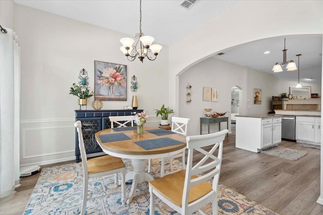 775 E Red House Branch Rd, Saint Augustine, FL 32084 - dining area featuring arched walkways, a chandelier, light wood-type flooring, and recessed lighting