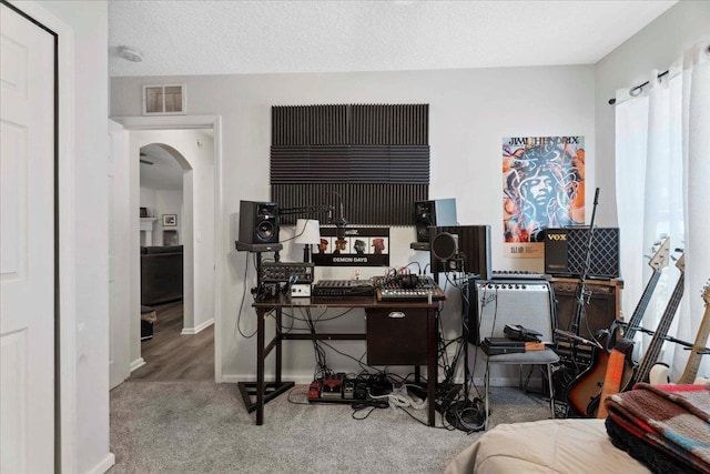775 E Red House Branch Rd, Saint Augustine, FL 32084 - home office with arched walkways, carpet flooring, and baseboards