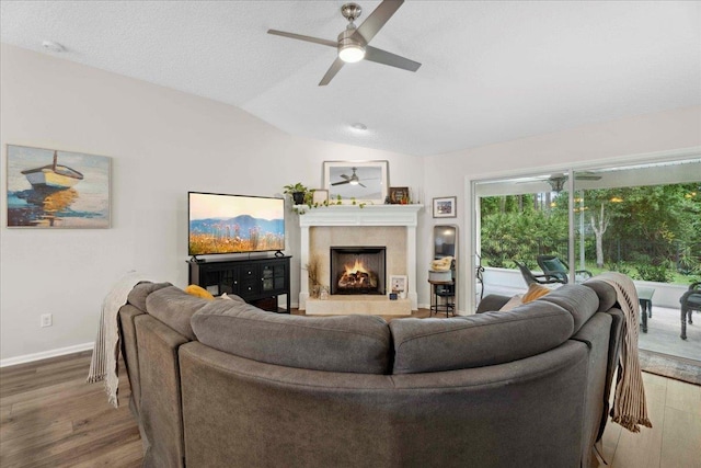 775 E Red House Branch Rd, Saint Augustine, FL 32084 - living room featuring ceiling fan, wood finished floors, vaulted ceiling, a fireplace, and baseboards