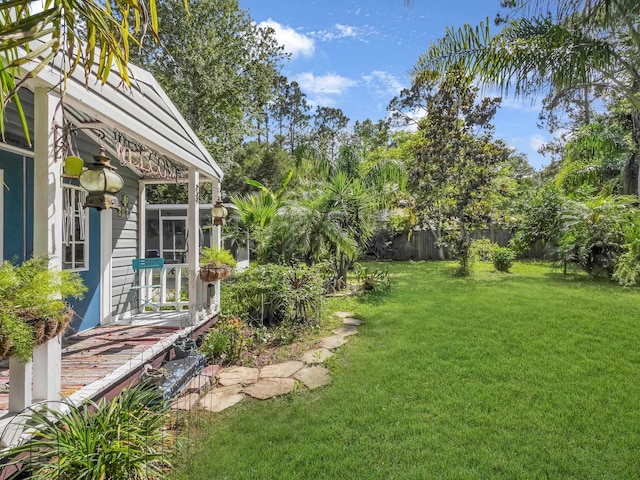 view of yard with a sunroom