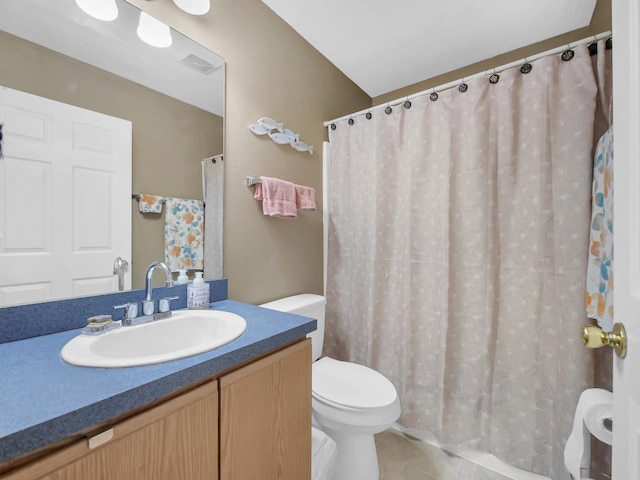 full bathroom featuring toilet, tile patterned flooring, vanity, and curtained shower