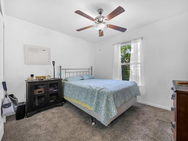 carpeted bedroom with baseboards and a ceiling fan