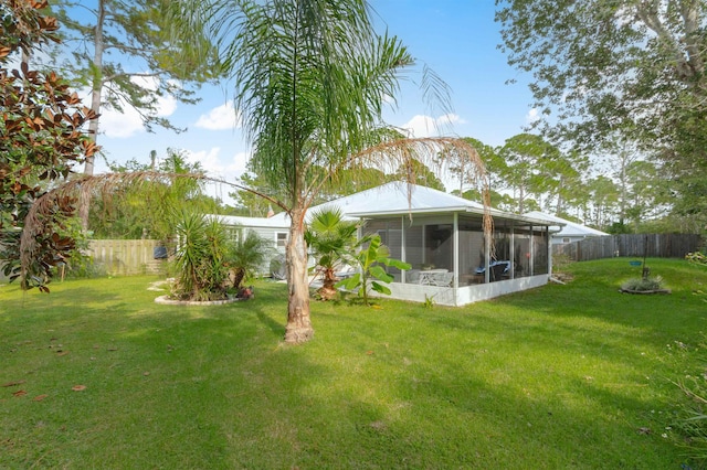 view of yard with a sunroom
