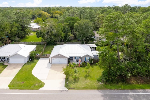 view of subject property featuring a heavily wooded area