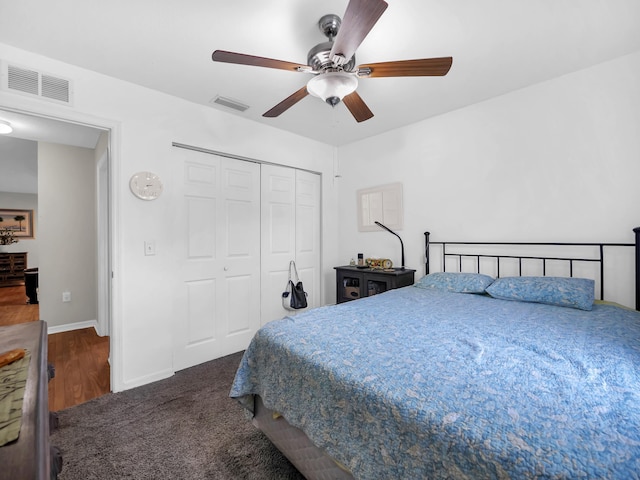 bedroom with a closet, baseboards, ceiling fan, and wood finished floors