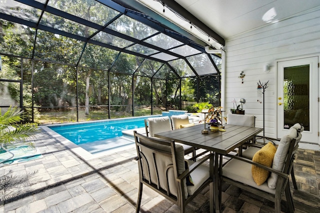 136 Island Hammock Way, Saint Augustine, FL 32080 - outdoor pool with a patio area, glass enclosure, and outdoor dining space