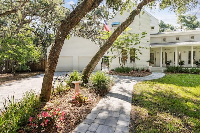 136 Island Hammock Way, Saint Augustine, FL 32080 - view of front of property featuring covered porch, driveway, a ceiling fan, and an attached garage