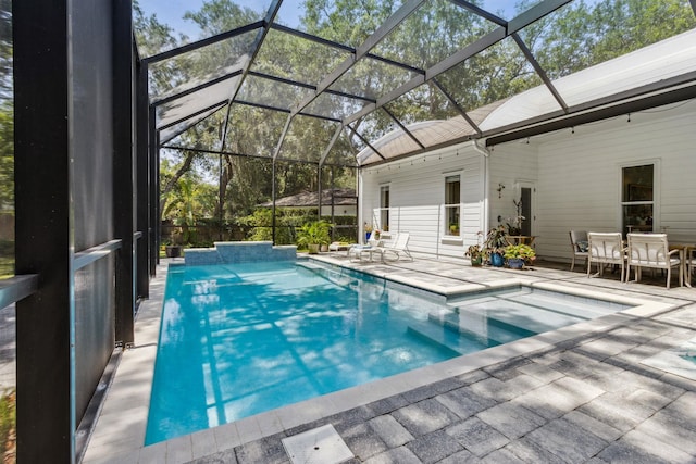 136 Island Hammock Way, Saint Augustine, FL 32080 - outdoor pool with a patio area and glass enclosure