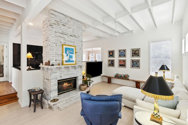 136 Island Hammock Way, Saint Augustine, FL 32080 - living area with wood finished floors, beamed ceiling, a stone fireplace, and baseboards