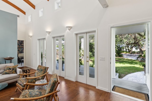 136 Island Hammock Way, Saint Augustine, FL 32080 - living area with french doors, beam ceiling, high vaulted ceiling, and wood finished floors