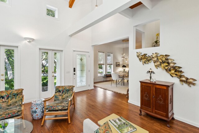 136 Island Hammock Way, Saint Augustine, FL 32080 - living room with wood finished floors, a high ceiling, and baseboards
