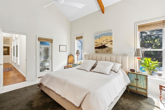 136 Island Hammock Way, Saint Augustine, FL 32080 - bedroom with high vaulted ceiling, a skylight, access to exterior, ceiling fan, and beamed ceiling