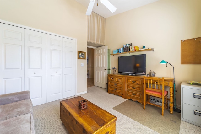 living room with ceiling fan and carpet flooring