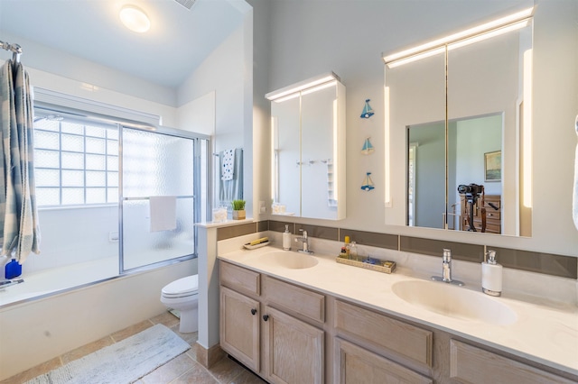 full bathroom with vanity, shower / bath combination with glass door, and toilet