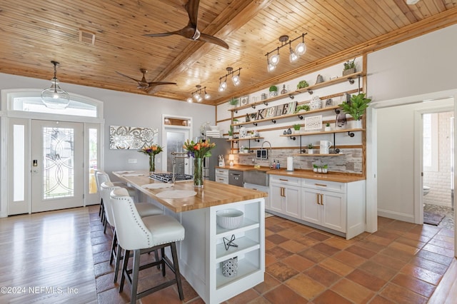 841 S County Road 13, Saint Augustine, FL 32092 - kitchen featuring ceiling fan, butcher block countertops, decorative light fixtures, white cabinets, and wood ceiling
