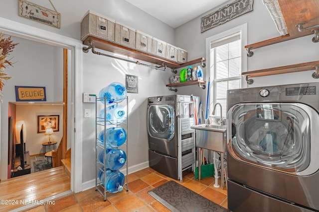 841 S County Road 13, Saint Augustine, FL 32092 - laundry area with separate washer and dryer, sink, and light tile patterned floors