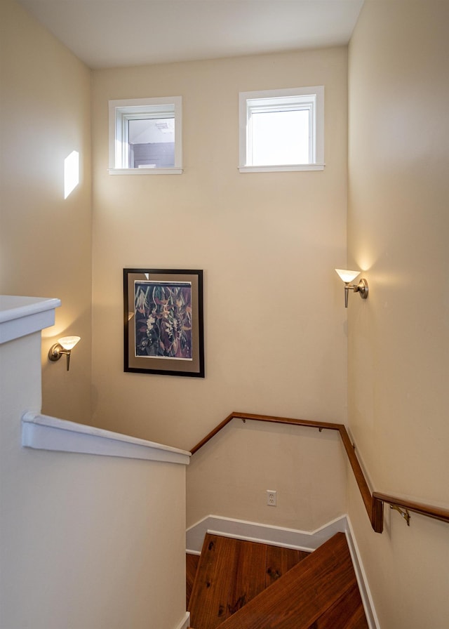 stairs with hardwood / wood-style floors