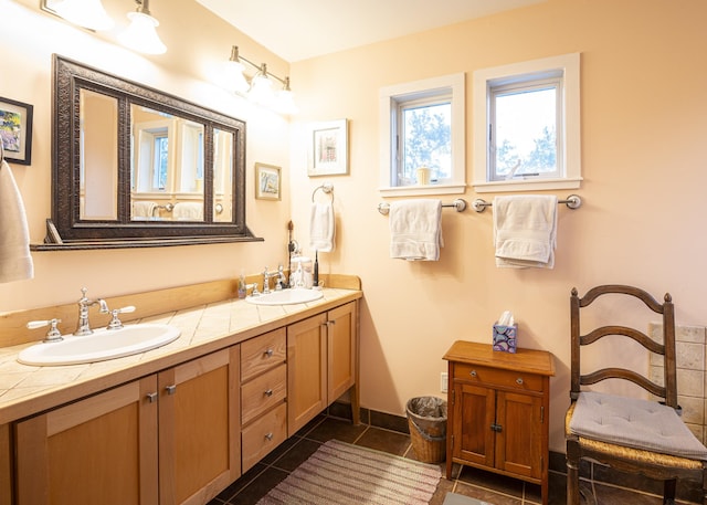 bathroom featuring tile patterned flooring and vanity