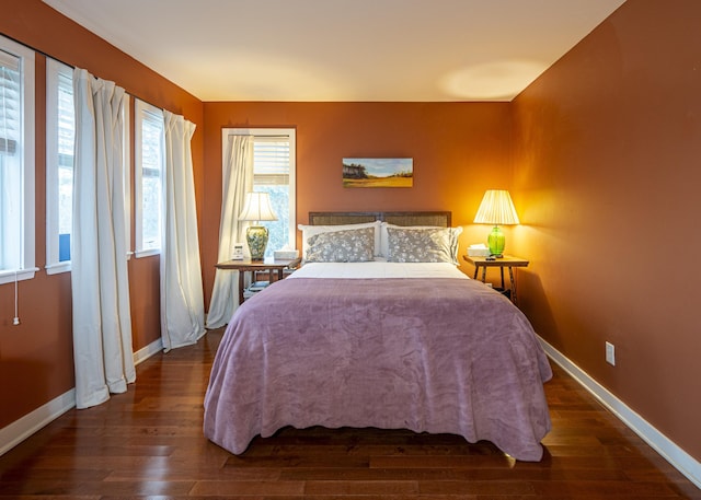 bedroom featuring dark wood-type flooring