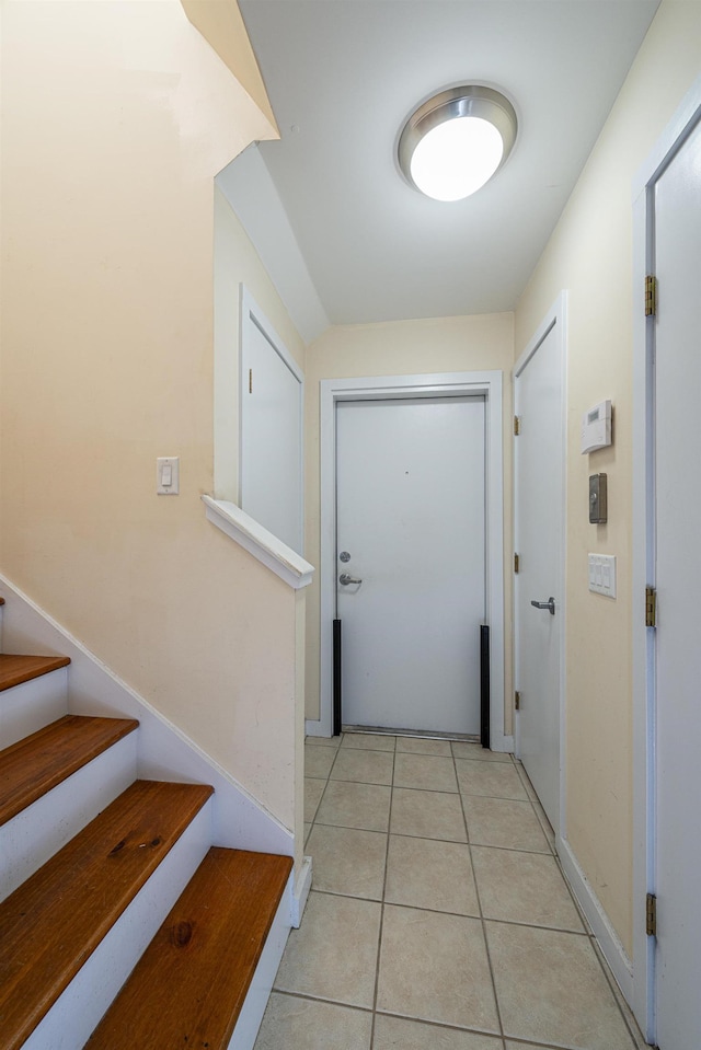 entryway featuring light tile patterned floors