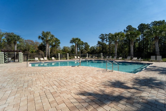 view of swimming pool with a patio area