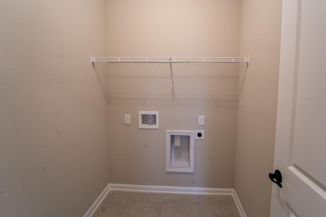 washroom featuring washer hookup, electric dryer hookup, and light tile patterned floors