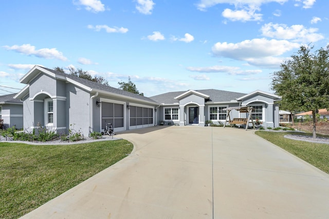 single story home with a garage and a front yard