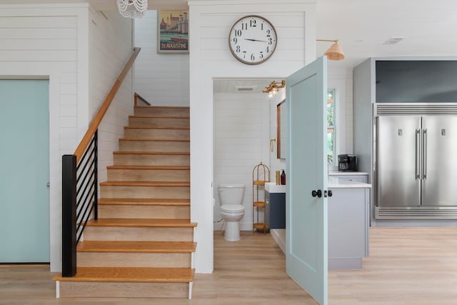 staircase featuring hardwood / wood-style flooring