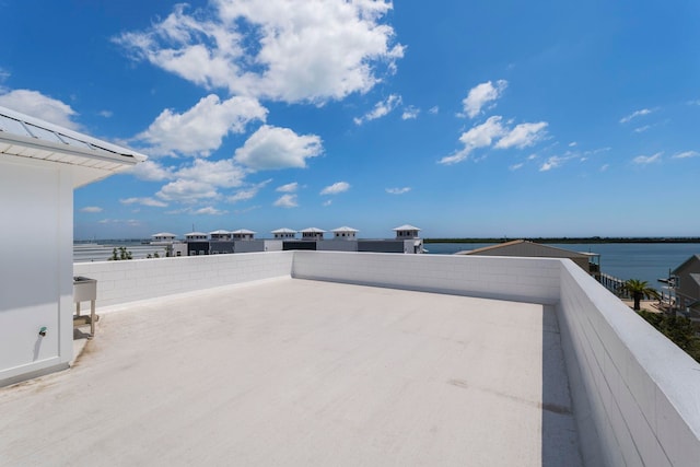 exterior space featuring a water view and a balcony