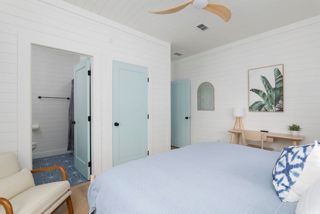 bedroom with ceiling fan and ensuite bathroom