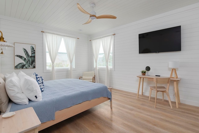 bedroom with ceiling fan, wood ceiling, and hardwood / wood-style flooring