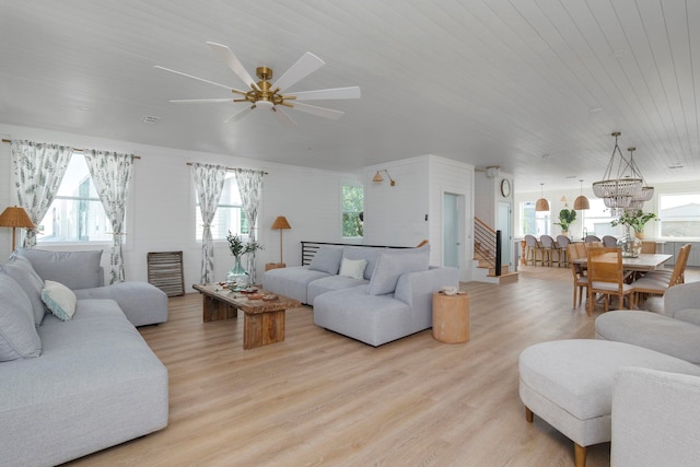 living room featuring wooden ceiling, light hardwood / wood-style floors, and ceiling fan with notable chandelier