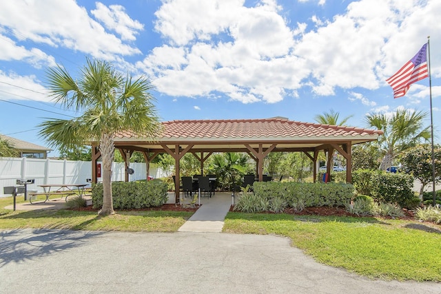 view of home's community with a gazebo and a lawn