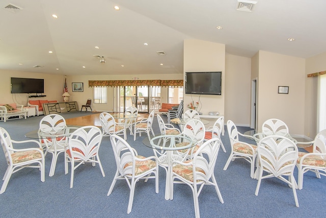 dining space with lofted ceiling