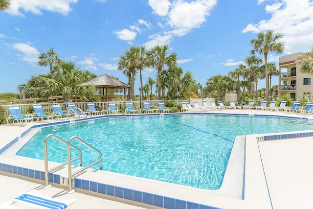 view of swimming pool featuring a patio area