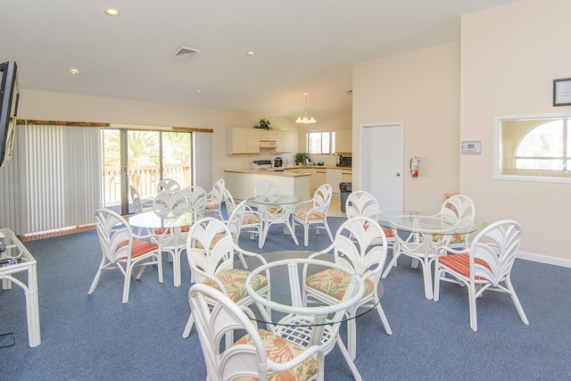 view of carpeted dining space