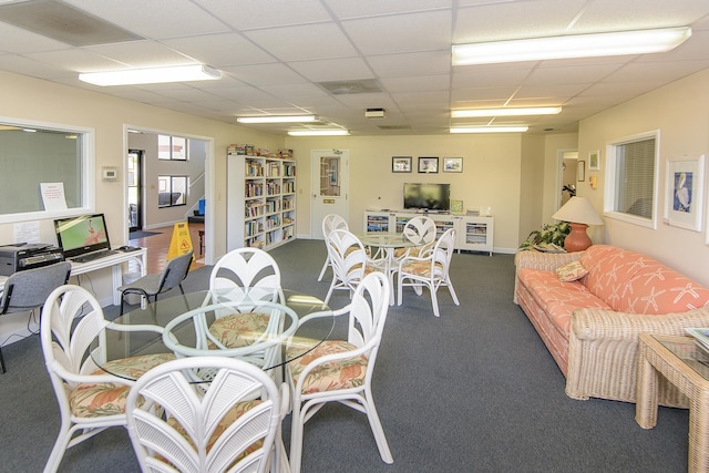 dining room featuring dark carpet