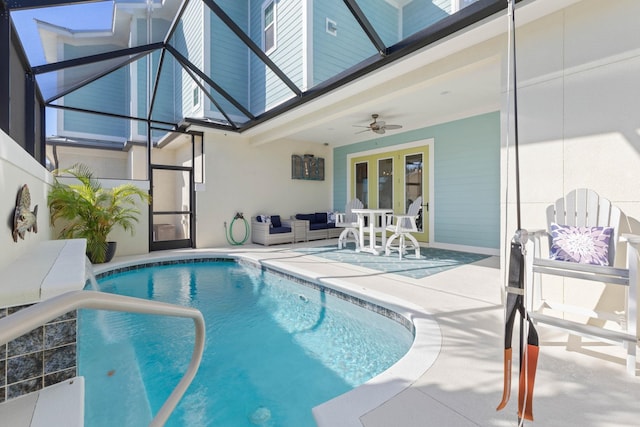 view of swimming pool featuring ceiling fan, a patio area, and an outdoor living space