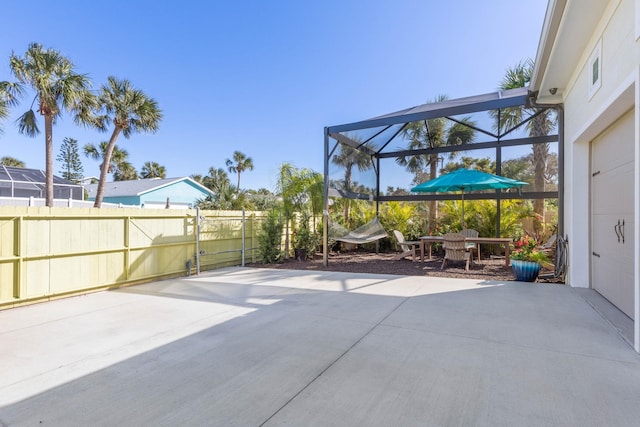 view of patio / terrace with a lanai