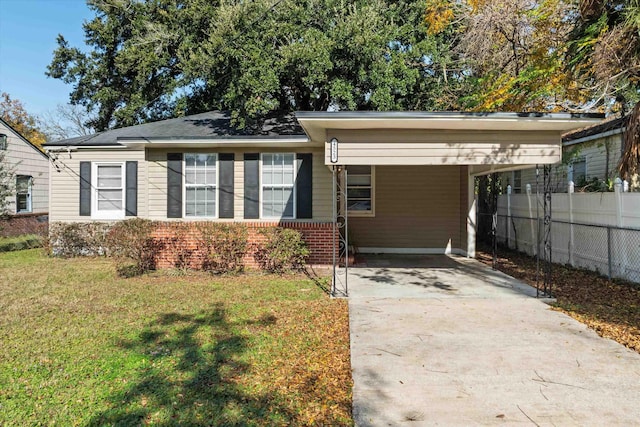 view of front of property with a front lawn and a carport